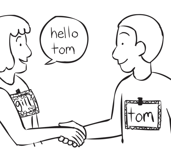 Two people shaking hands in a fun get-to-know-you Name-Tag game